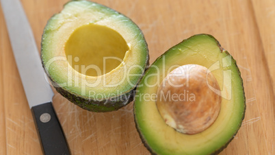 Fresh Cut Avocado on Wooden Cutting Board