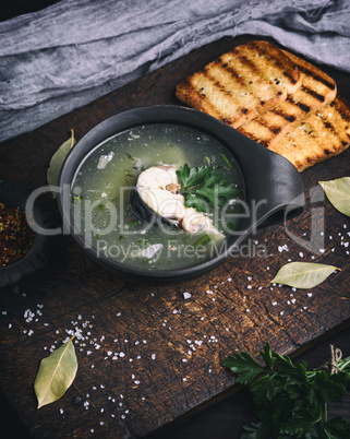 fish soup of mackerel in a brown clay plate