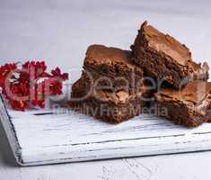 pile of square slices of baked brownie pie