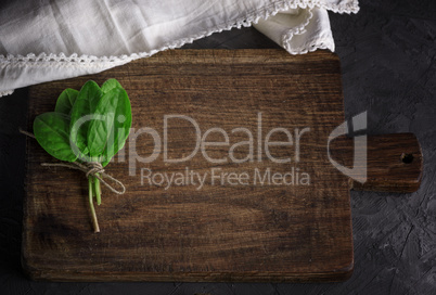 old vintage kitchen cutting board and bunch with green sorrel