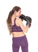 Woman standing from back with boxing cloves