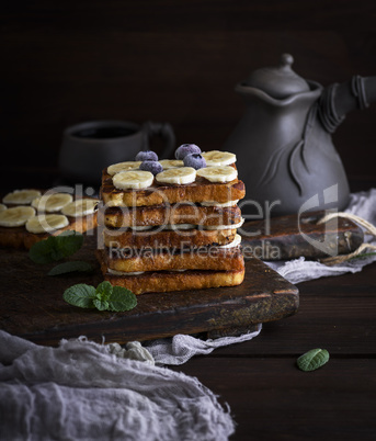 French toast on a brown wooden board