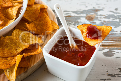 Chili sauce and nachos chips