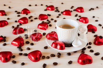 Chocolate hearts and coffee beans on a table