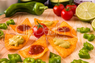 Close up of nachos chips and vegetables