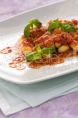 Gnocchi, Italian pasta with tomato sauce basil and grana cheese
