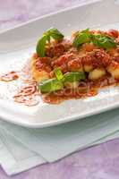 Gnocchi, Italian pasta with tomato sauce basil and grana cheese