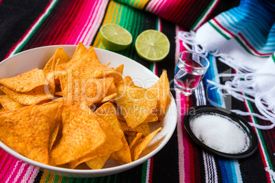 Nachos chips in a bowl tequila lime and salt