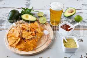 Nachos with sauces beer and avocado