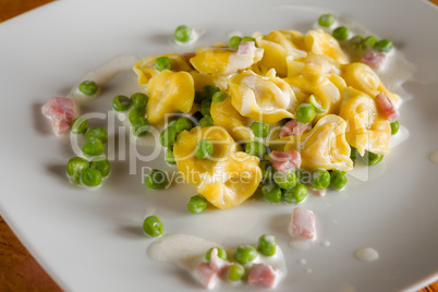 Tortellini with cream ham and peas