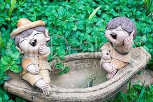 ton figures in a garden