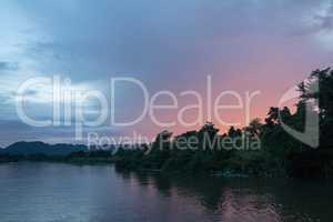 Boat trip on the river Kwai with sunset