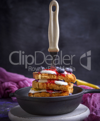 French toast with berries, syrup and sour cream