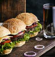 hamburger with beef, onion, tomato, lettuce, cheese and drink