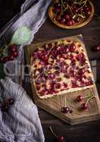 baked cake with cherries