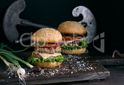 double burger with vegetables and cheese