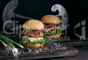 double burger with vegetables and cheese