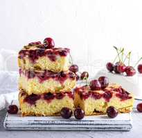 a stack of baked square pieces of cherry pie