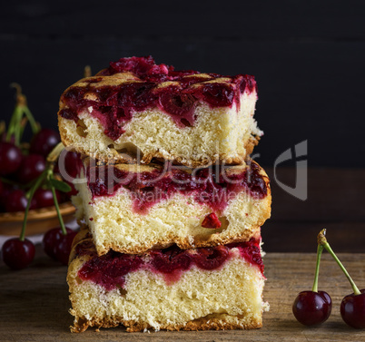 a stack of baked square slices of a cherry pie