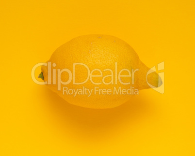 Fresh lemon on yellow background