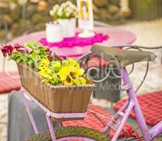 bicycle with flowers at a street cafe