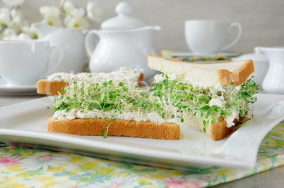 Sandwich with ricotta and alfalfa sprouts