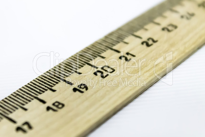 drawing ruler diagonally over white background