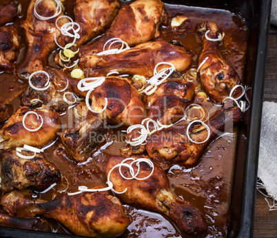 fried on a baking sheet in tomato sauce chicken legs