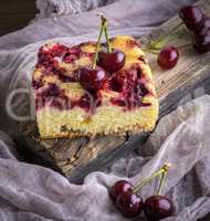 piece of biscuit baked cake with cherry