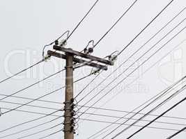Post with electric transmission wires on white background