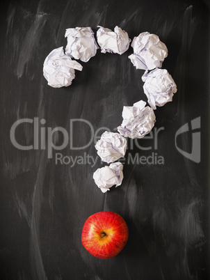 Question mark with a red apple