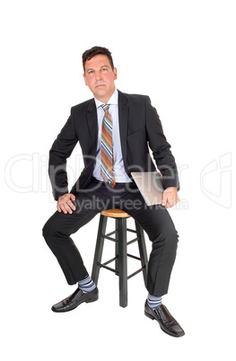 Business man sitting with laptop in hand Business man sitting with laptop in hand