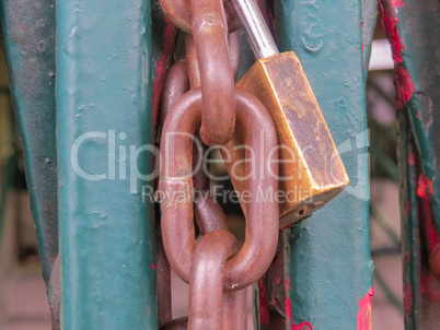 Close up view of lock and chain closing gate.