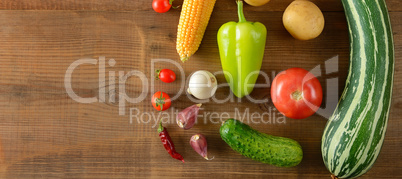 set of vegetables laid out on a wooden table. Top view. Free spa