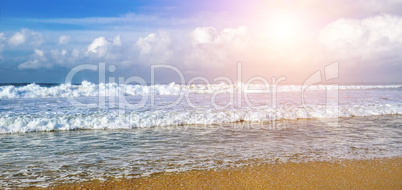 Seascape and sun on blue sky background. Wide photo.