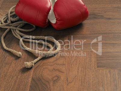 Boxing gloves on a wooden floor