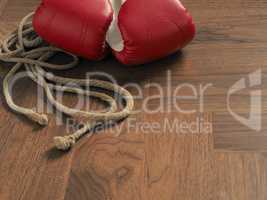 Boxing gloves on a wooden floor