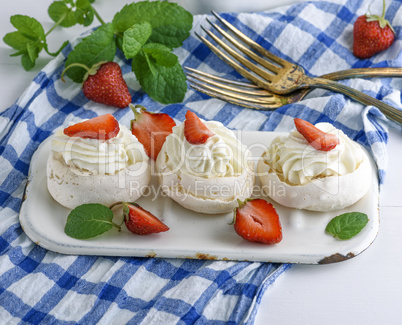 baked meringue with cream and fresh strawberries