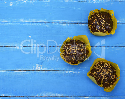 chocolate cupcakes wrapped in yellow paper