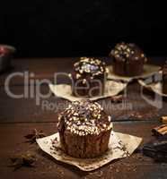 chocolate muffins on a brown  background