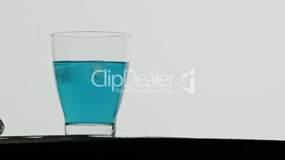 Ice cubed dropped in a blue drink