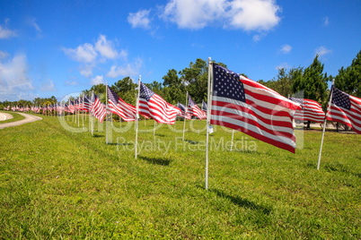 Patriotic display of multiple large American flags