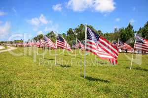 Patriotic display of multiple large American flags