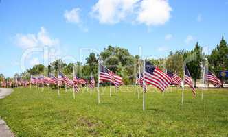Patriotic display of multiple large American flags