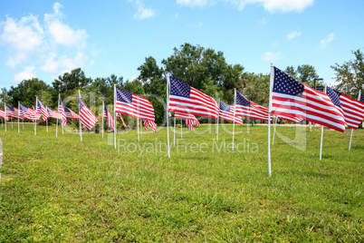 Patriotic display of multiple large American flags