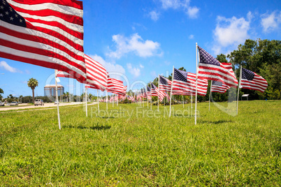 Patriotic display of multiple large American flags