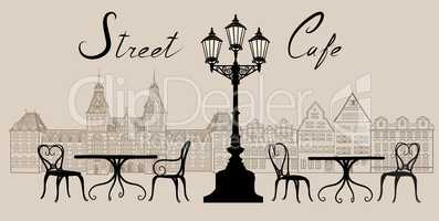 Street cafe in old city. Cityscape view. Travel Europe background.