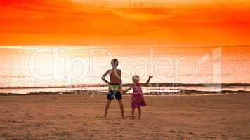 children standing on a beach