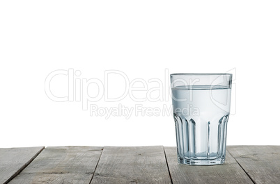 Glass of water on wooden table