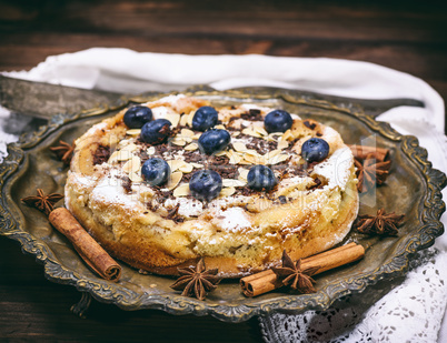 baked round homemade pie with blueberries